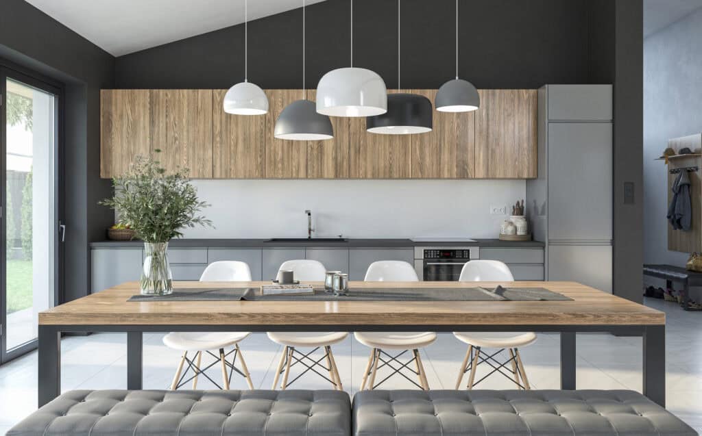 Gestoffeerde eetkamerbank aan een houten eettafel in een moderne landelijke keuken