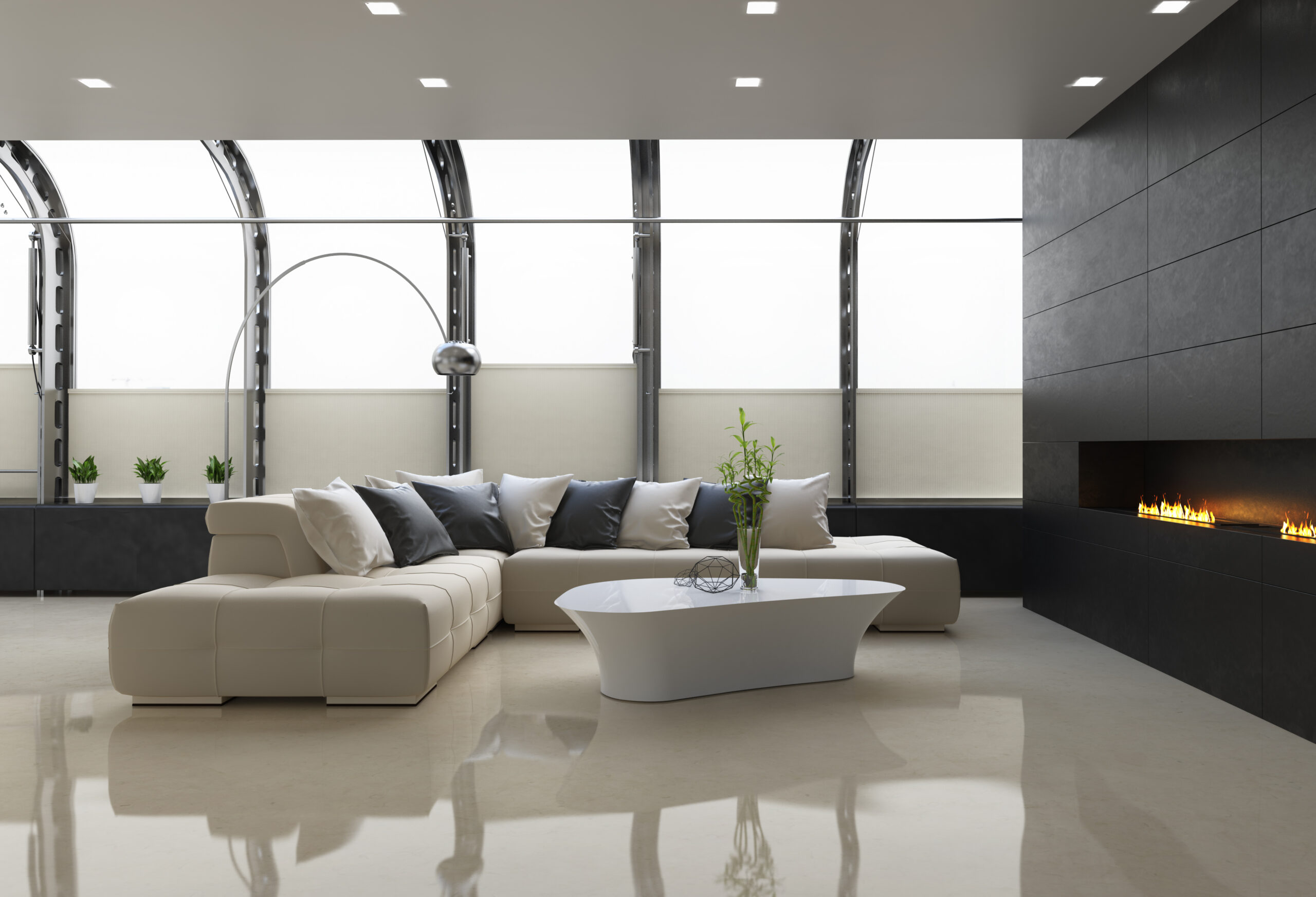 Lichte gietvloer in moderne woonkamer met witte bank en haard