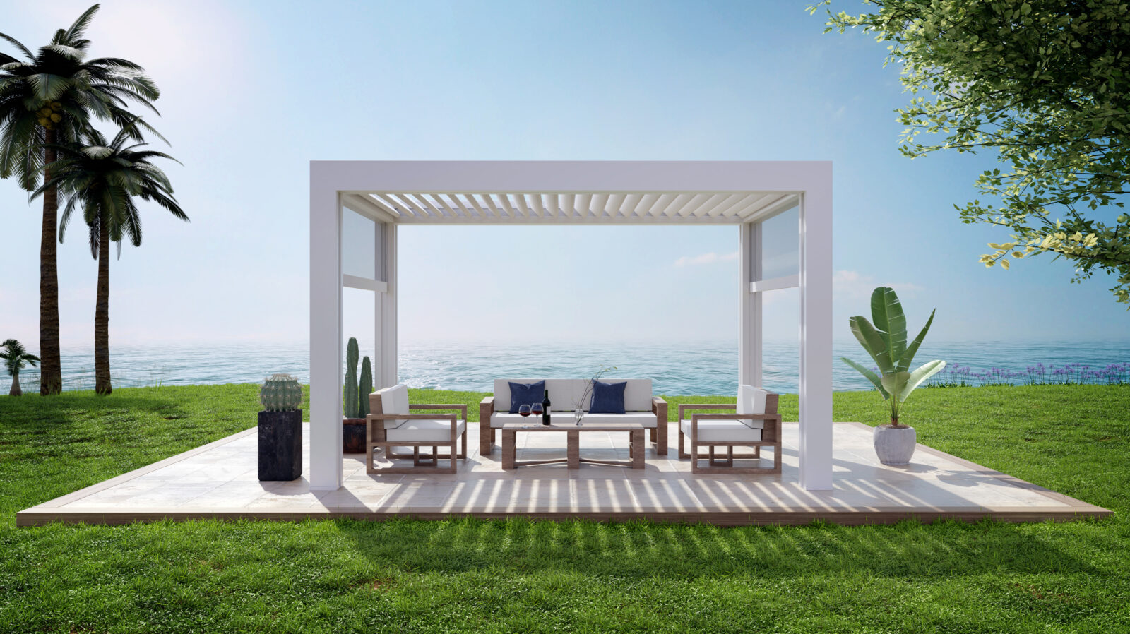 Moderne vrijstaande witte aluminium overkapping met loungeset en uitzicht op zee, onder een openblauwe hemel