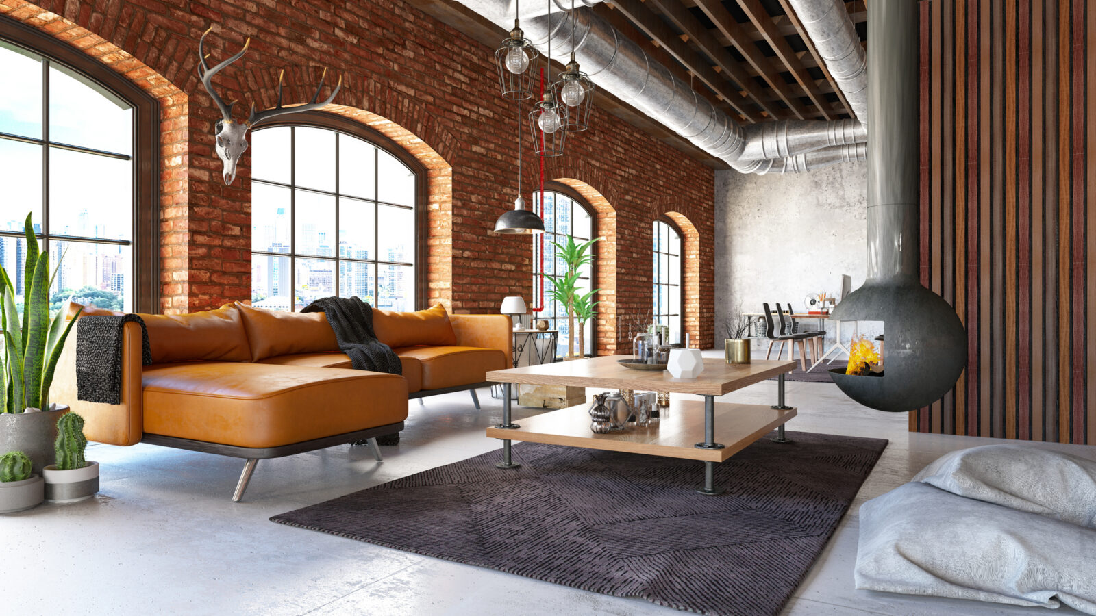 Hangende design houtkachel in industriële loft met bakstenen muren en leren bank