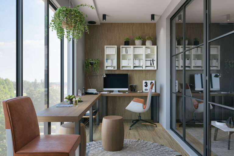 Modern thuiskantoor met veel daglicht, houten bureau, ergonomische stoel en groene planten aan de wand.