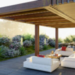 Moderne terrasoverkapping aan huis met loungehoek en eettafel